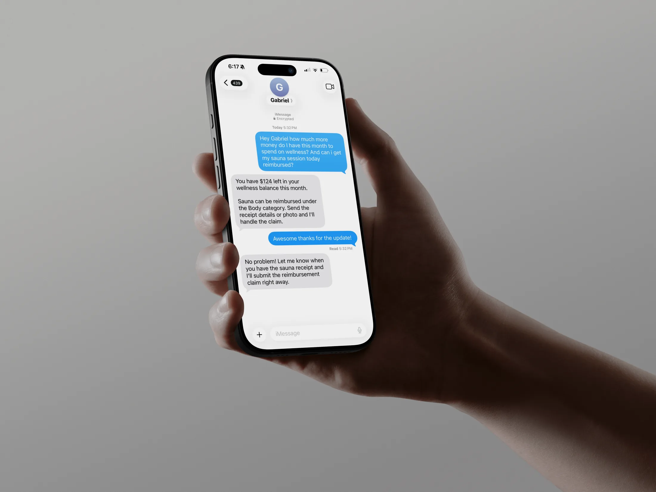 A realistic iPhone held in one hand showing a Gabriel iMessage reimbursement conversation.